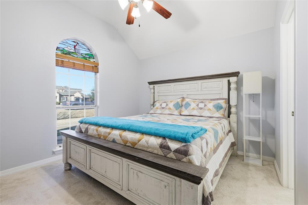 7915 Stone Ridge Drive Northlake, TX 76247 - Photo 23 of 40 a bedroom with a bed and a painting on the wall
