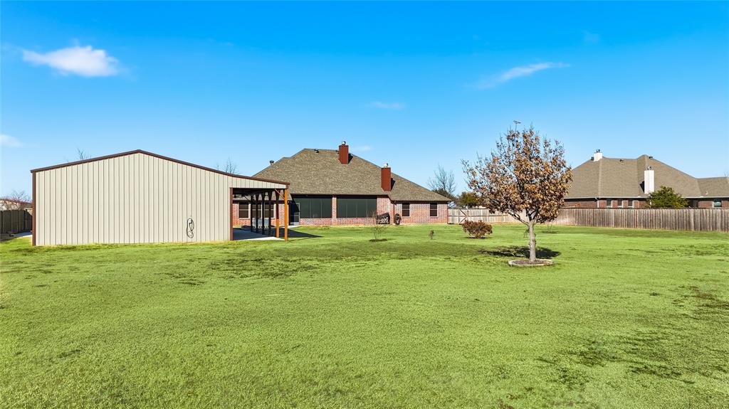 7915 Stone Ridge Drive Northlake, TX 76247 - Photo 27 of 40 a front view of a house with a yard