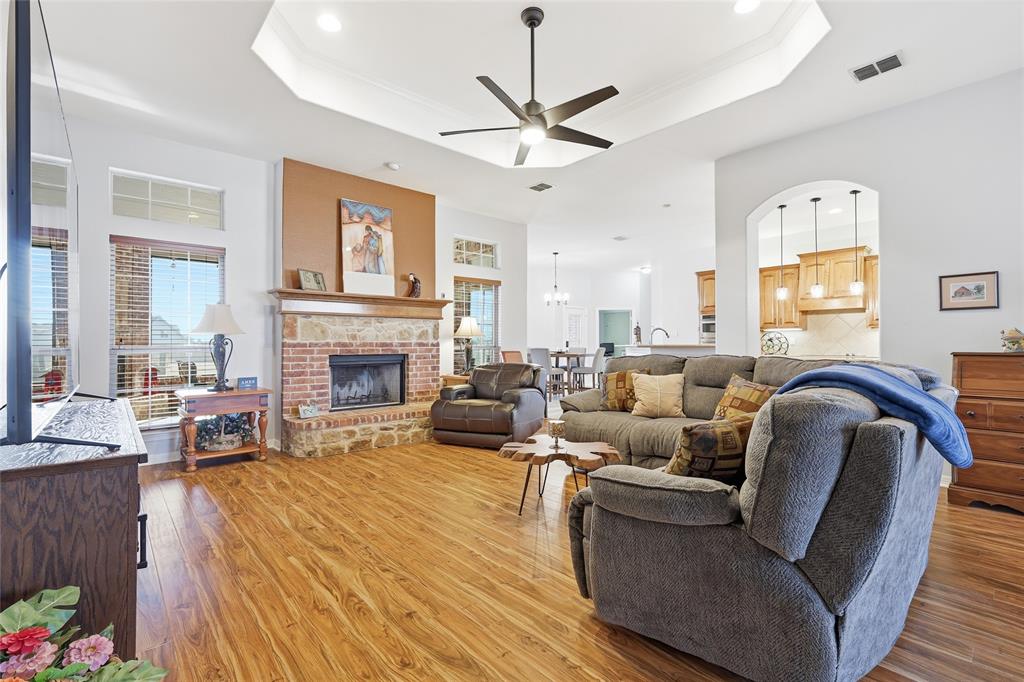 7915 Stone Ridge Drive Northlake, TX 76247 - Photo 9 of 40 a living room with furniture and a fireplace
