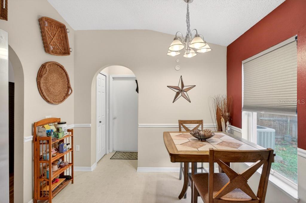 1332 Honey Road Apopka, FL 32712 - Photo 12 of 59 a view of a dining room with furniture