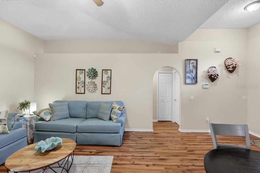 1332 Honey Road Apopka, FL 32712 - Photo 3 of 59 a living room with furniture and a wooden floor