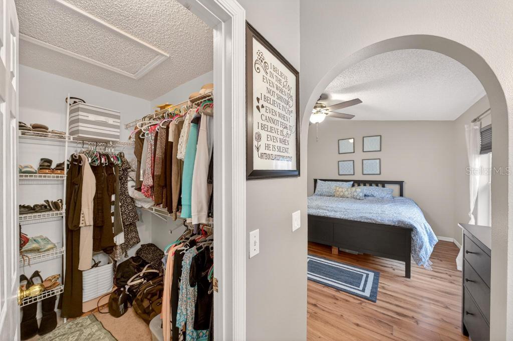 1332 Honey Road Apopka, FL 32712 - Photo 33 of 59 a view of walk in closet with clothes and shoes