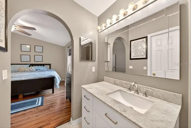 a bathroom with a shower a toilet and a window