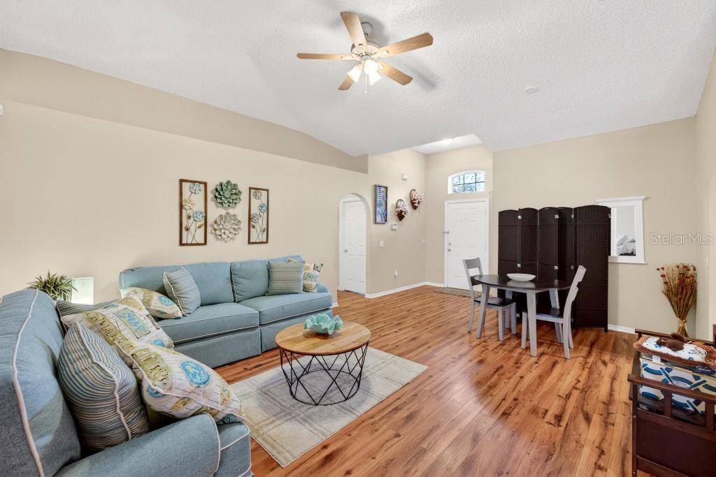 1332 Honey Road Apopka, FL 32712 - Photo 7 of 59 a living room with furniture and wooden floor