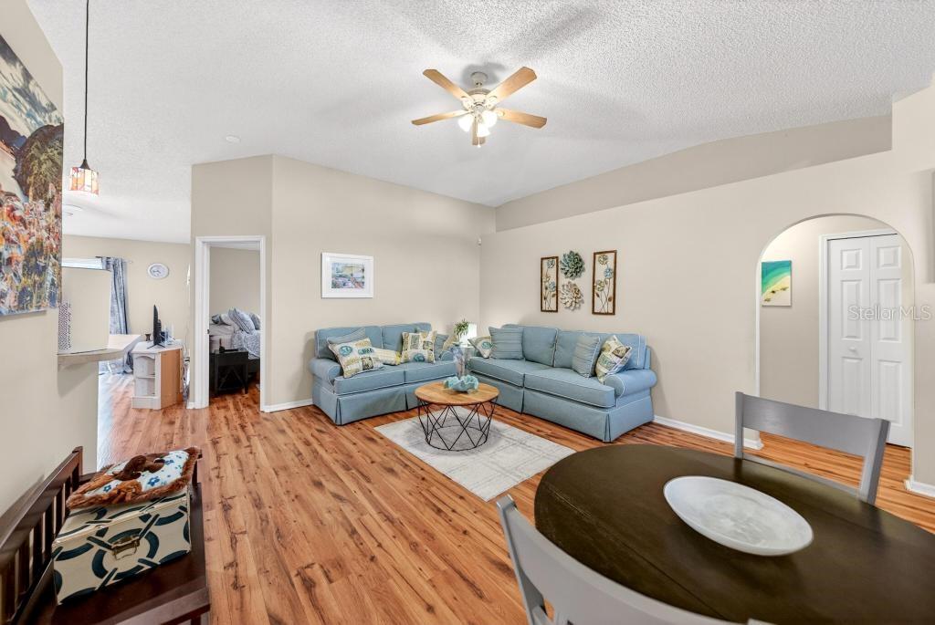 1332 Honey Road Apopka, FL 32712 - Photo 9 of 59 a living room with furniture and a chandelier