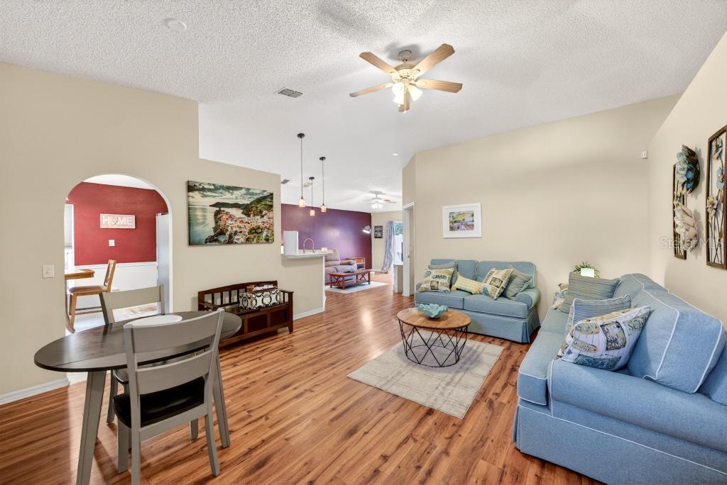 1332 Honey Road Apopka, FL 32712 - Photo 10 of 59 a living room with furniture and wooden floor