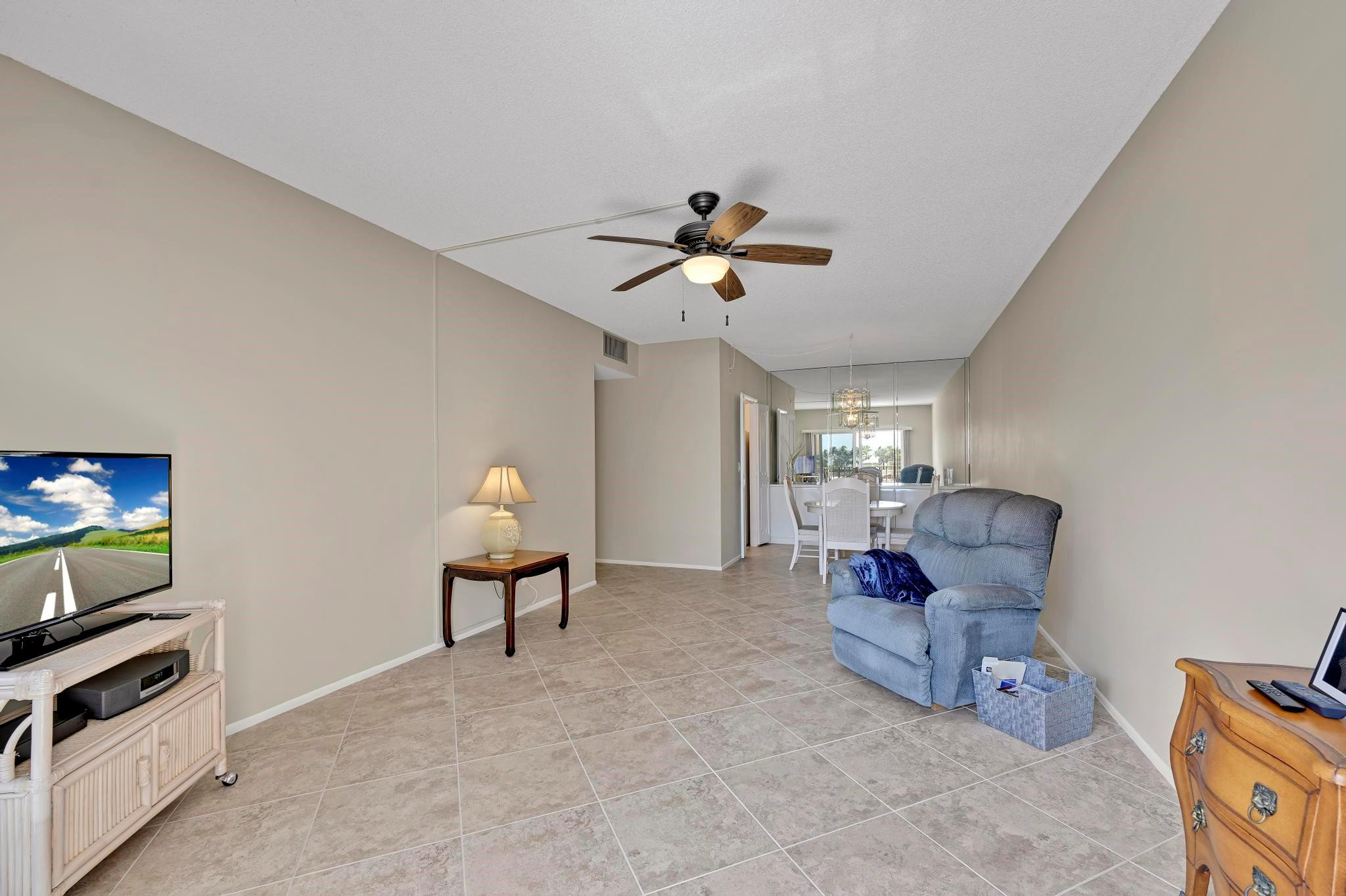 400 North Riverside Drive, Unit 404 Pompano Beach, FL 33062 - Photo 16 of 29 a living room with furniture