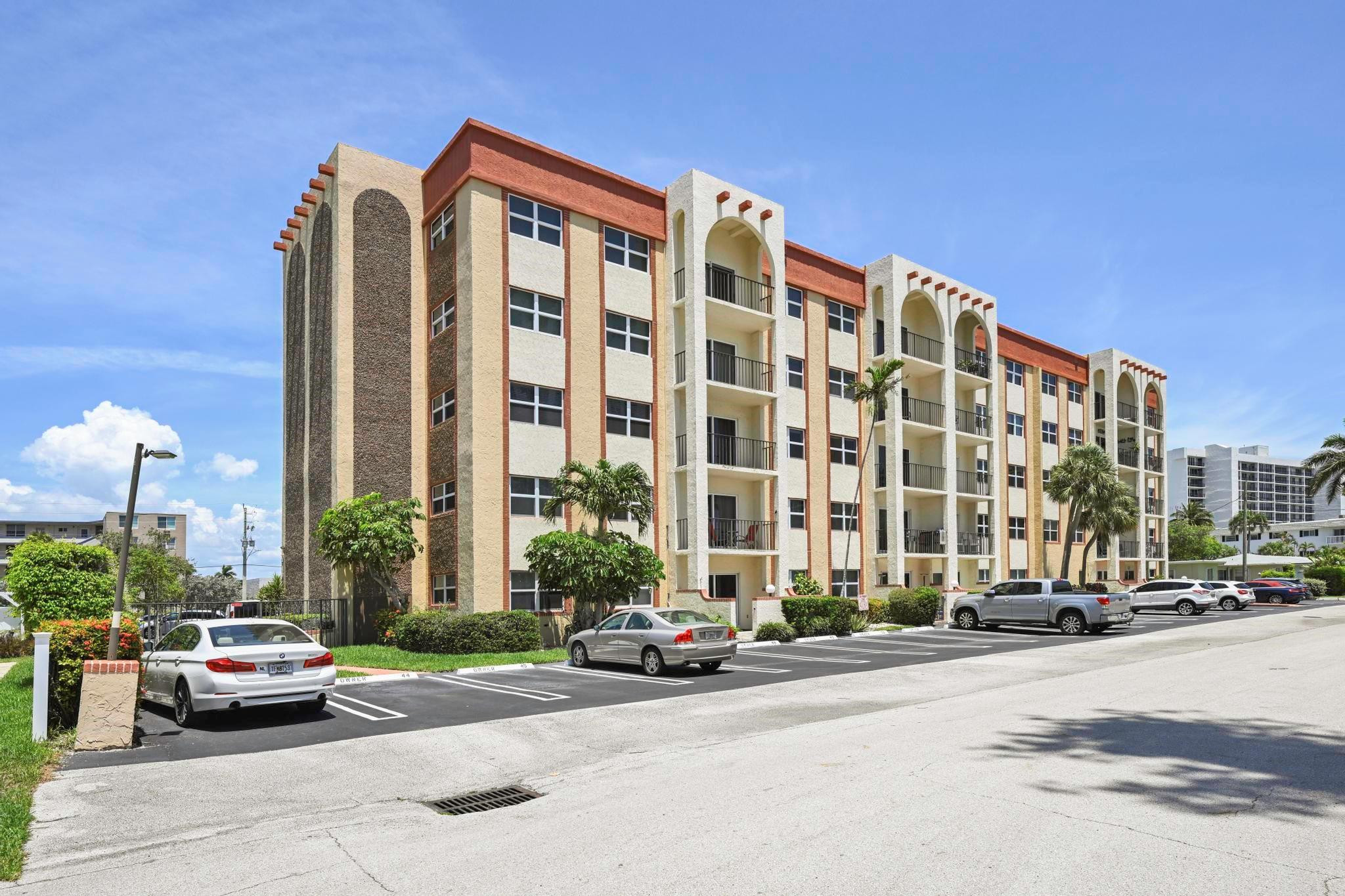 400 North Riverside Drive, Unit 404 Pompano Beach, FL 33062 - Photo 17 of 29 a front view of a building with street view