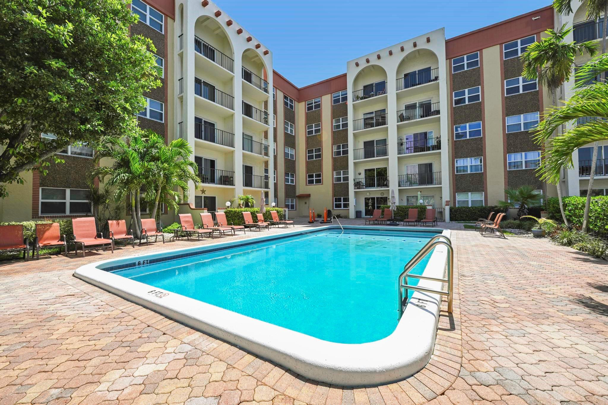 400 North Riverside Drive, Unit 404 Pompano Beach, FL 33062 - Photo 2 of 29 a view of swimming pool with outdoor seating