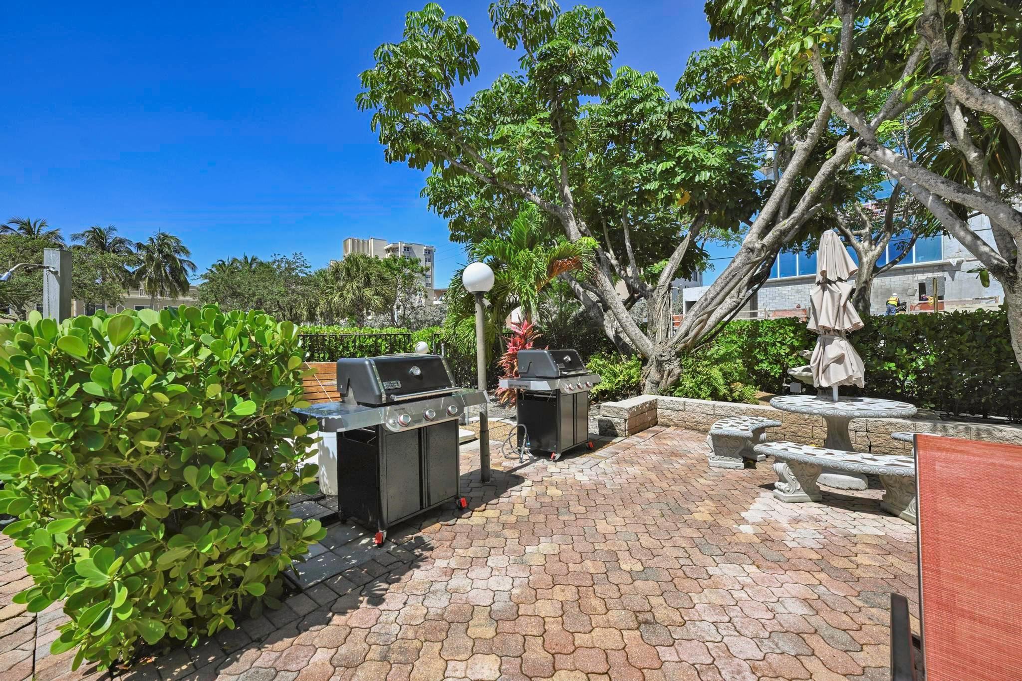 400 North Riverside Drive, Unit 404 Pompano Beach, FL 33062 - Photo 26 of 29 a view of a backyard with sitting area
