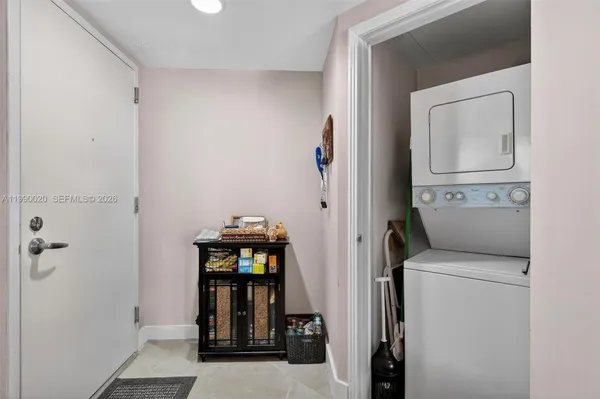a kitchen with granite countertop a stove and a microwave