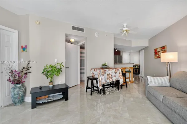 a living room with furniture and a window