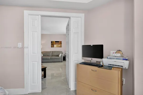 a view of walk in closet with clothes