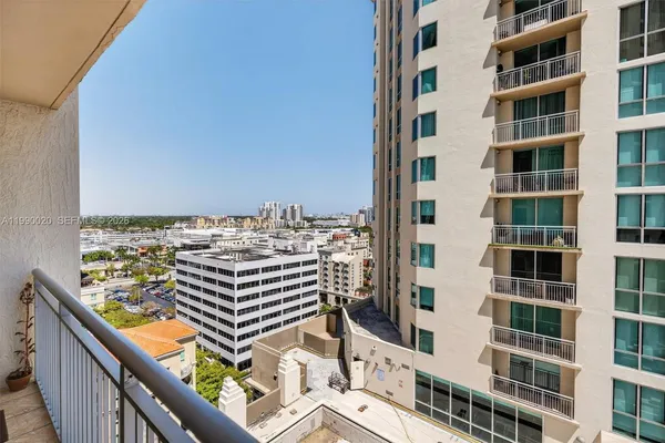 a view of a balcony with furniture