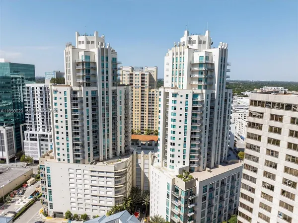 a view of a building with traffic signal lights