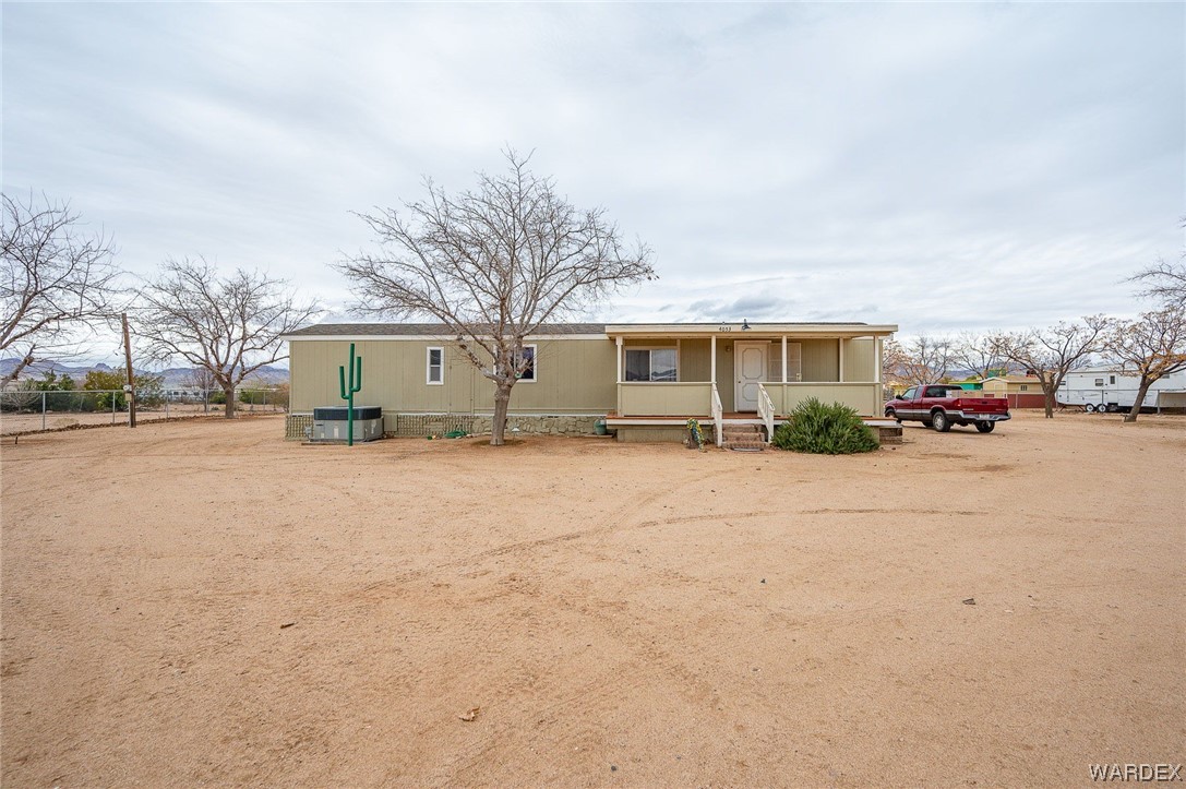4053 Cowlic Road Golden Valley, AZ 86413 - Photo 4 of 25 a front view of a building with trees
