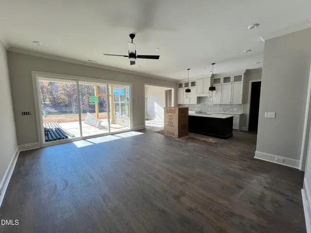 a room with wooden floor and closet