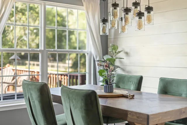 a view of a dining room with furniture window and outside view
