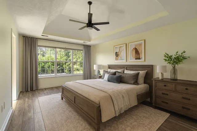 a bedroom with a large bed and a window