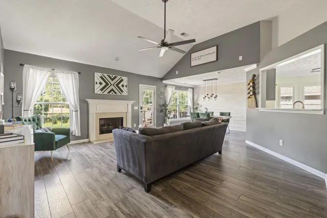 a living room with furniture and a fireplace