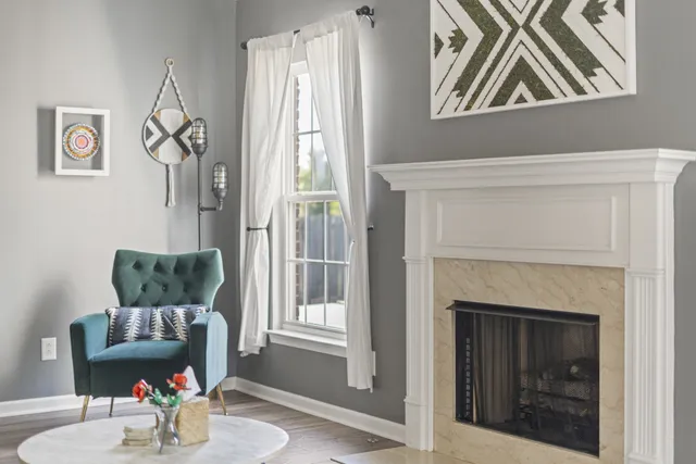 a living room with furniture and a fireplace