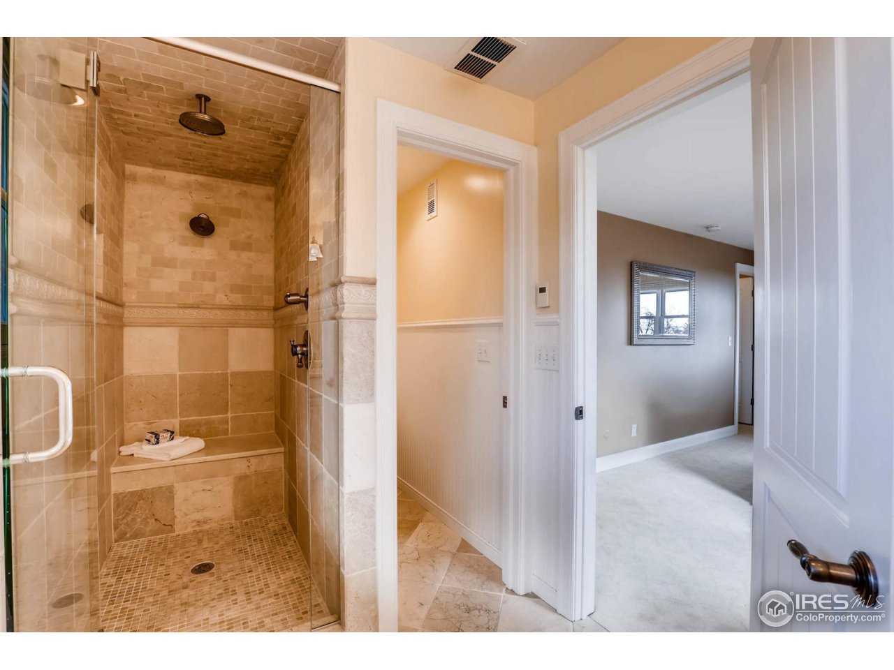 2610 Regis Drive Boulder, CO 80305 - Photo 13 of 29 a bathroom with a glass door shower and a sink