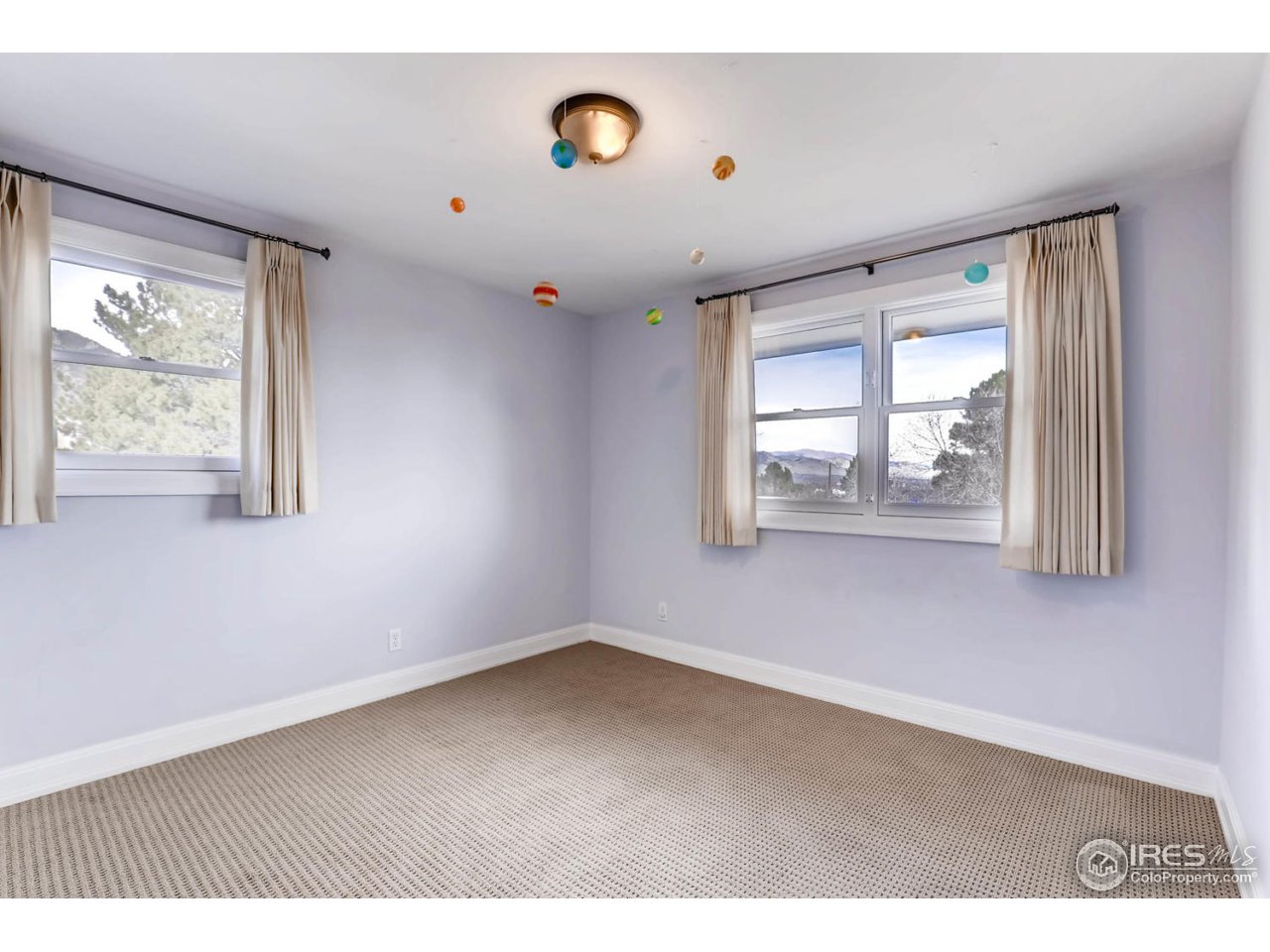 2610 Regis Drive Boulder, CO 80305 - Photo 17 of 29 an empty room with windows and entrance