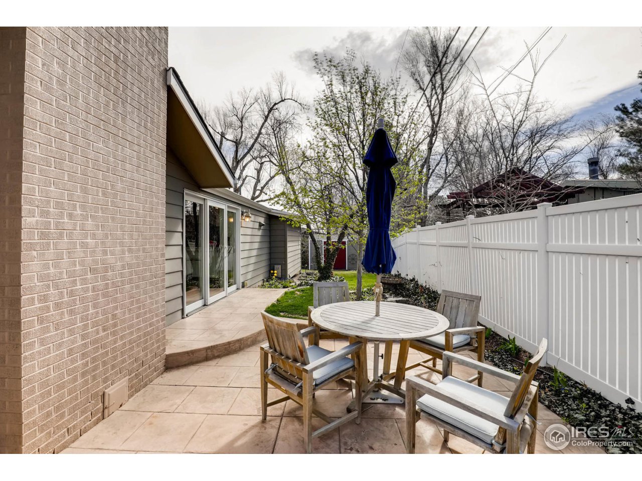 2610 Regis Drive Boulder, CO 80305 - Photo 21 of 29 a backyard of a house with table and chairs