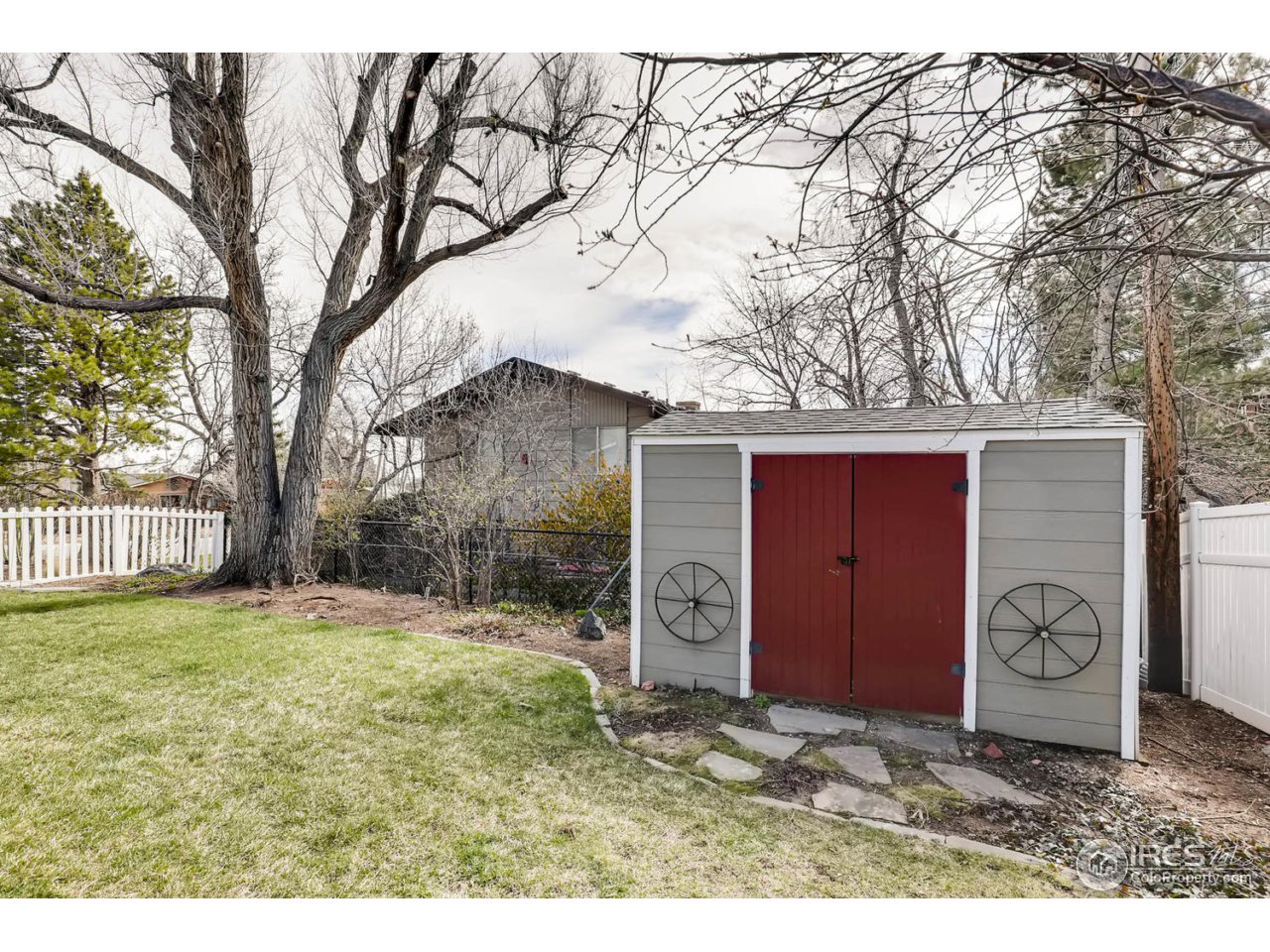 2610 Regis Drive Boulder, CO 80305 - Photo 23 of 29 a house with trees in front of it
