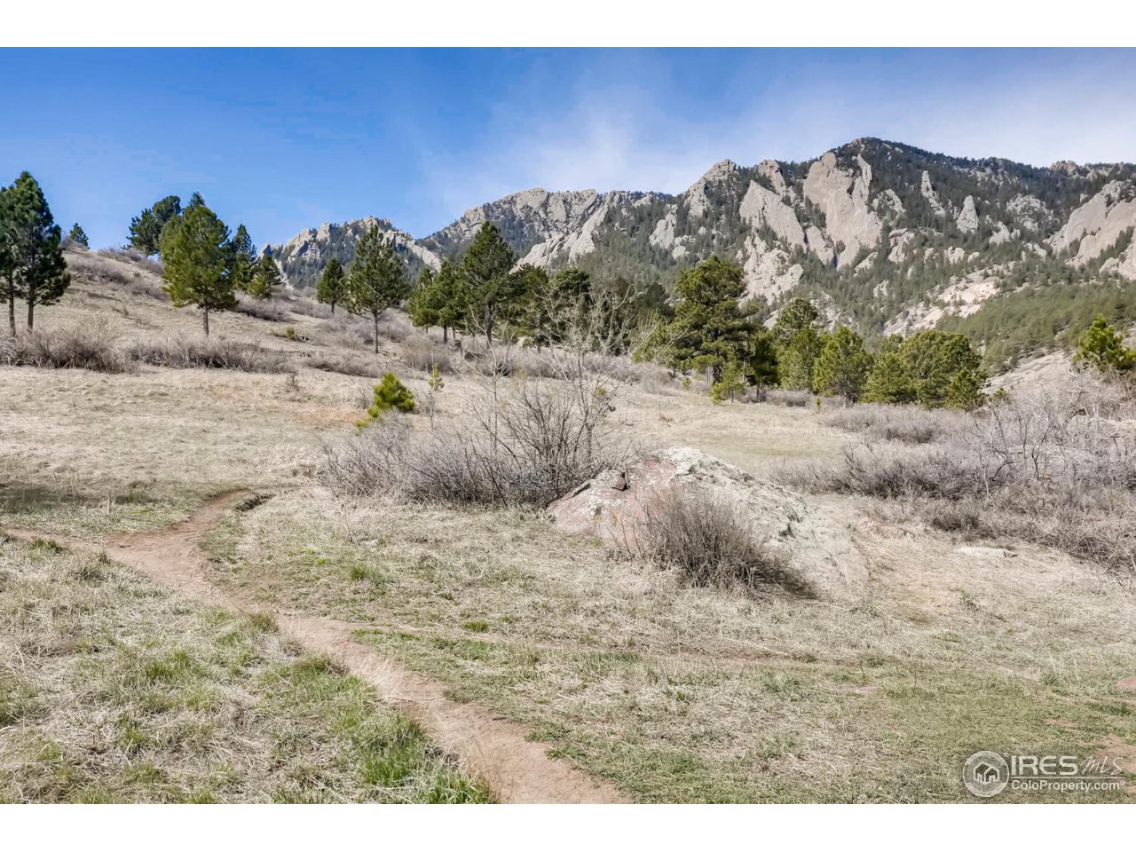2610 Regis Drive Boulder, CO 80305 - Photo 26 of 29 a view of a dry yard with mountains in the background
