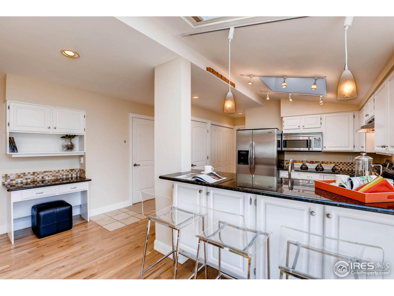 2610 Regis Drive Boulder, CO 80305 - Photo 3 of 29 a kitchen with stainless steel appliances granite countertop a sink and cabinets