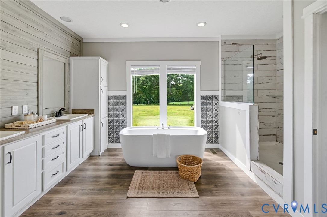 13110 Continental Road Wilsons, VA 23894 - Photo 20 of 35 Freestanding soaking tub, wood-finish flooring, du