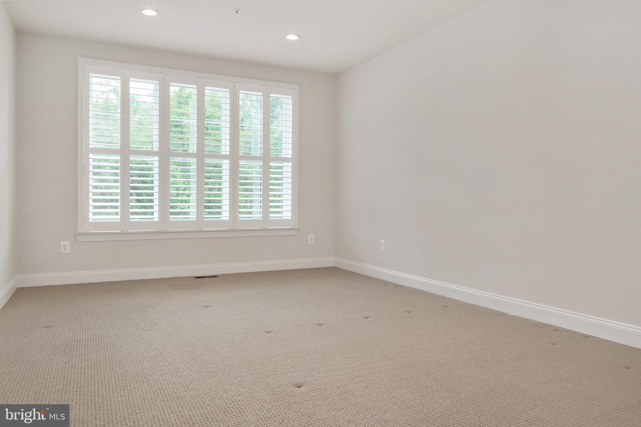 8631 St Anthony Drive Severn, MD 21144 - Photo 17 of 41 an empty room with a window