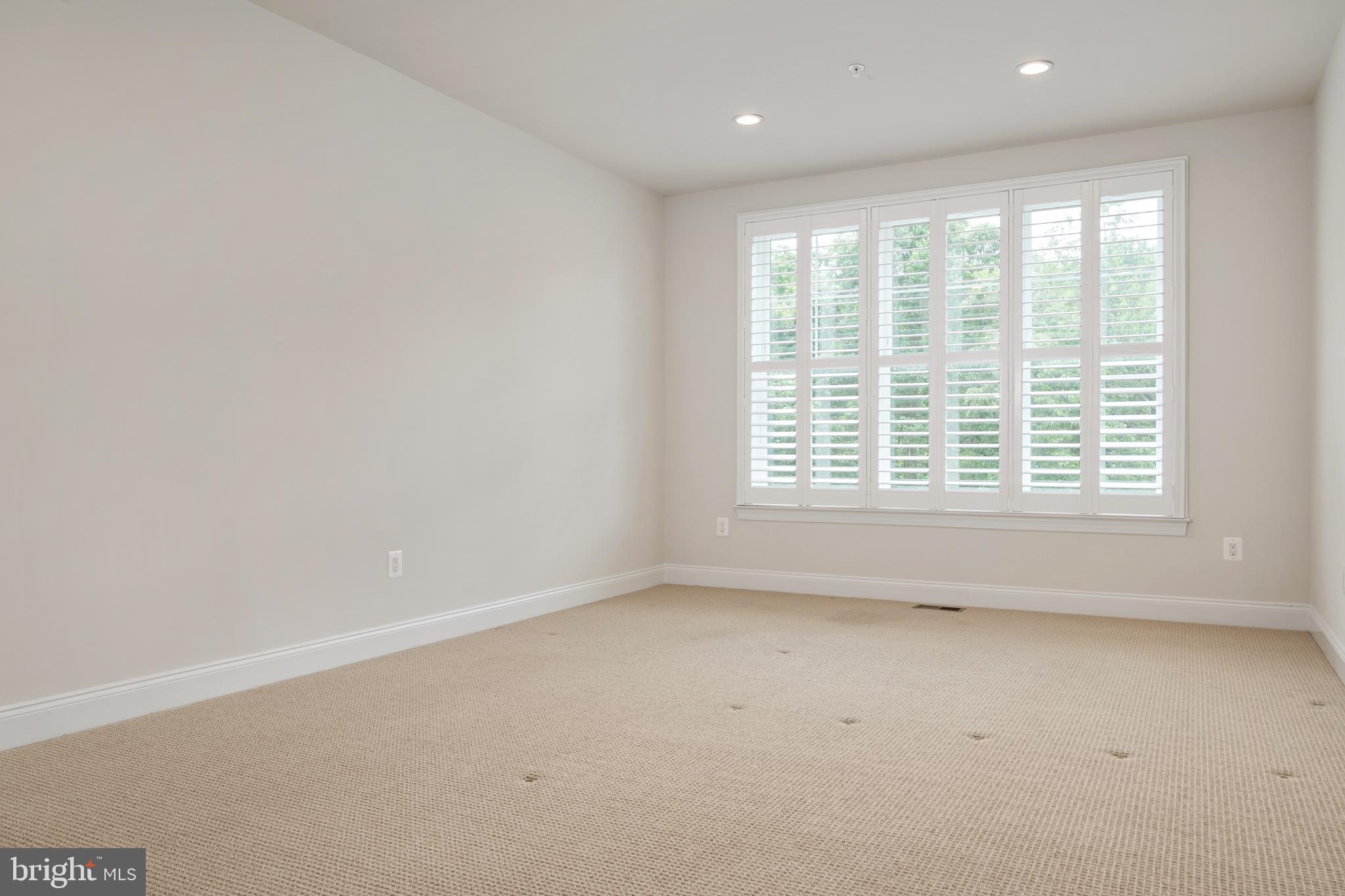 8631 St Anthony Drive Severn, MD 21144 - Photo 18 of 41 an empty room with a window