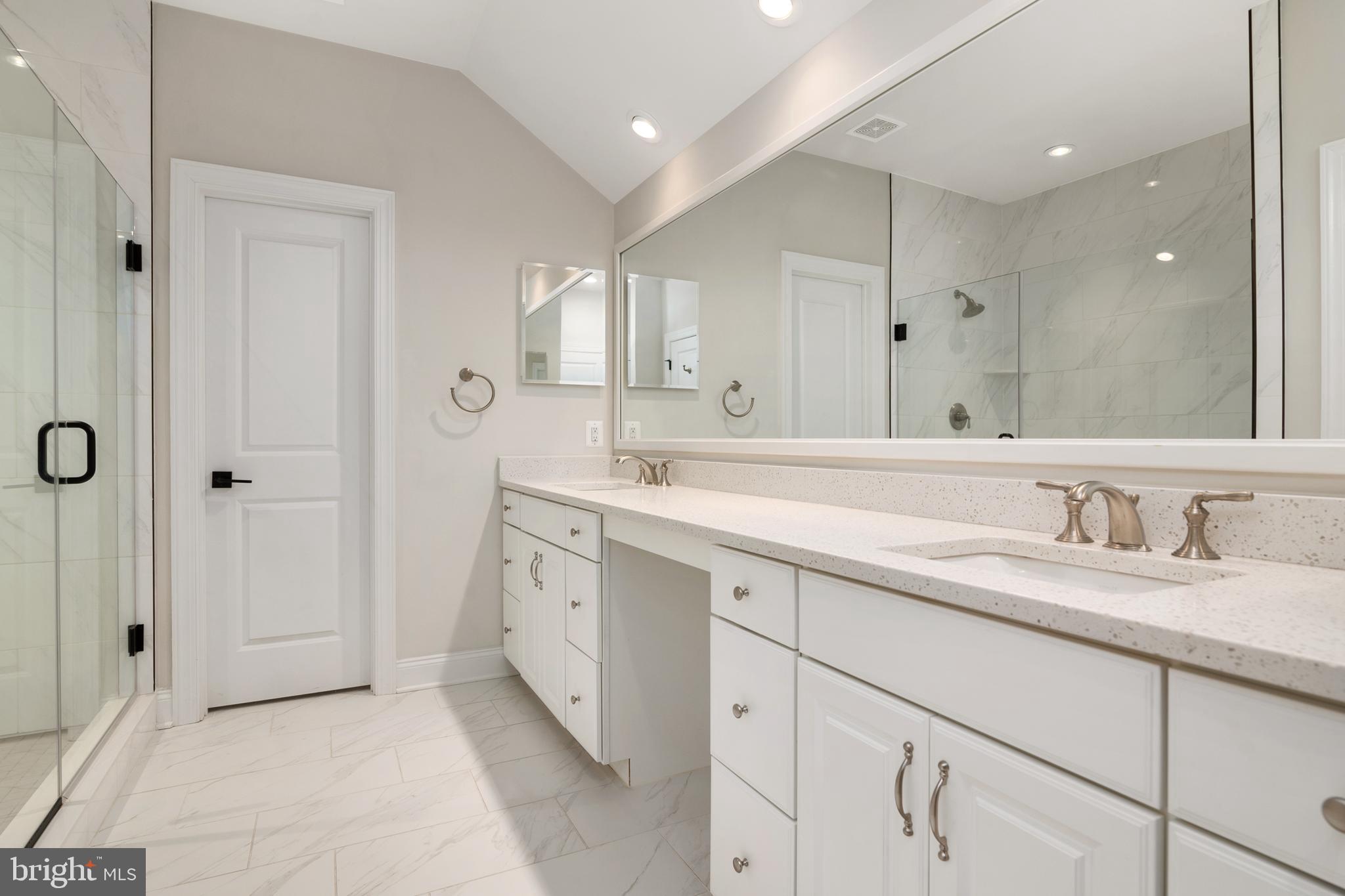 8631 St Anthony Drive Severn, MD 21144 - Photo 20 of 41 a spacious bathroom with a granite countertop sink mirror and double