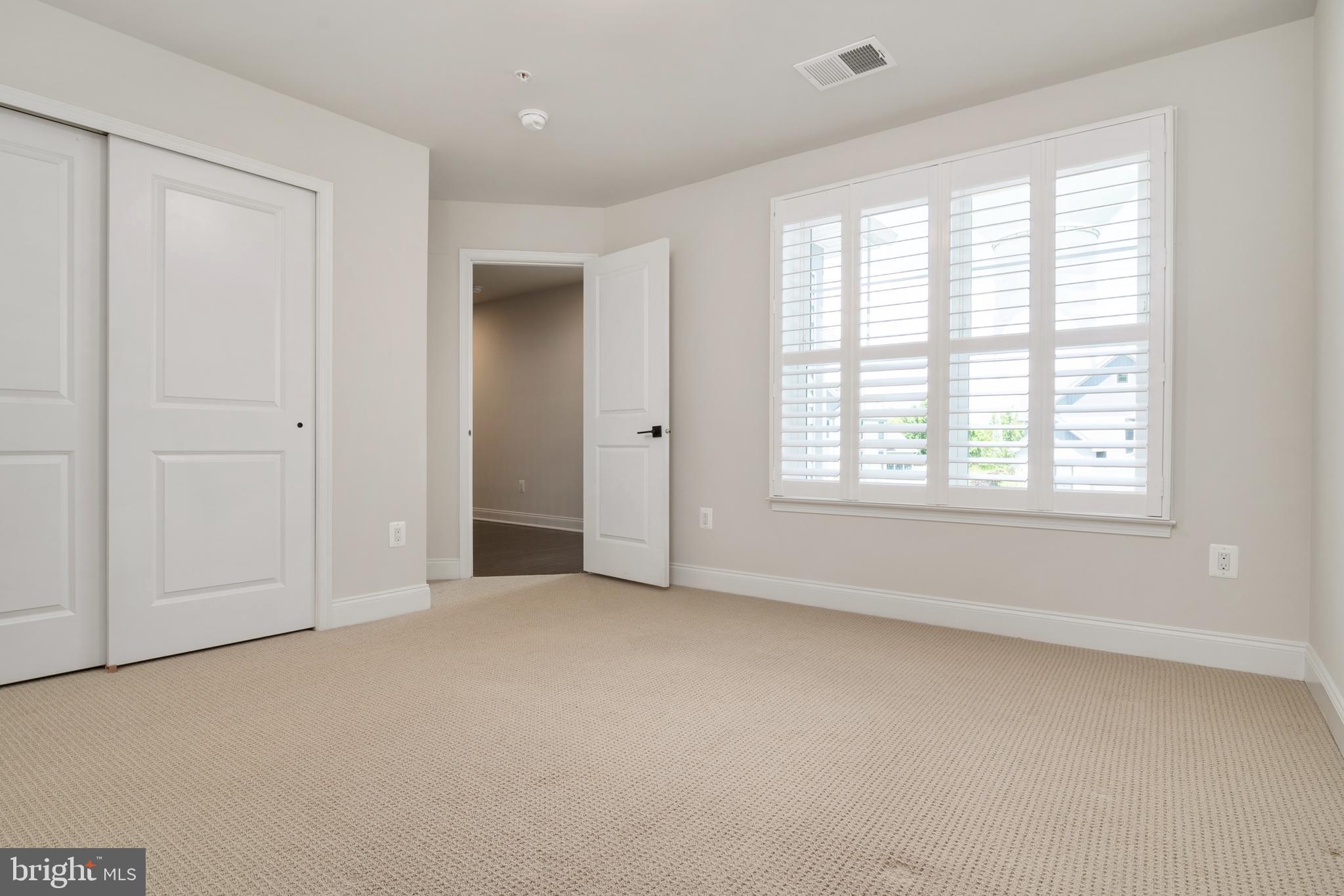 8631 St Anthony Drive Severn, MD 21144 - Photo 25 of 41 a view of an empty room with a window