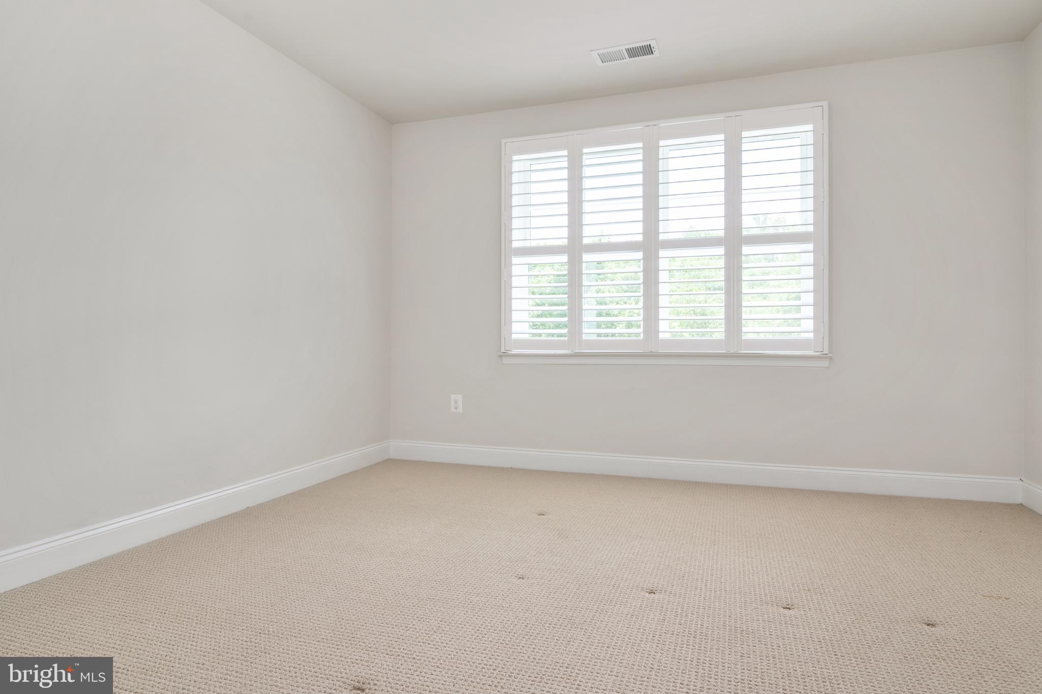 8631 St Anthony Drive Severn, MD 21144 - Photo 31 of 41 an empty room with a window