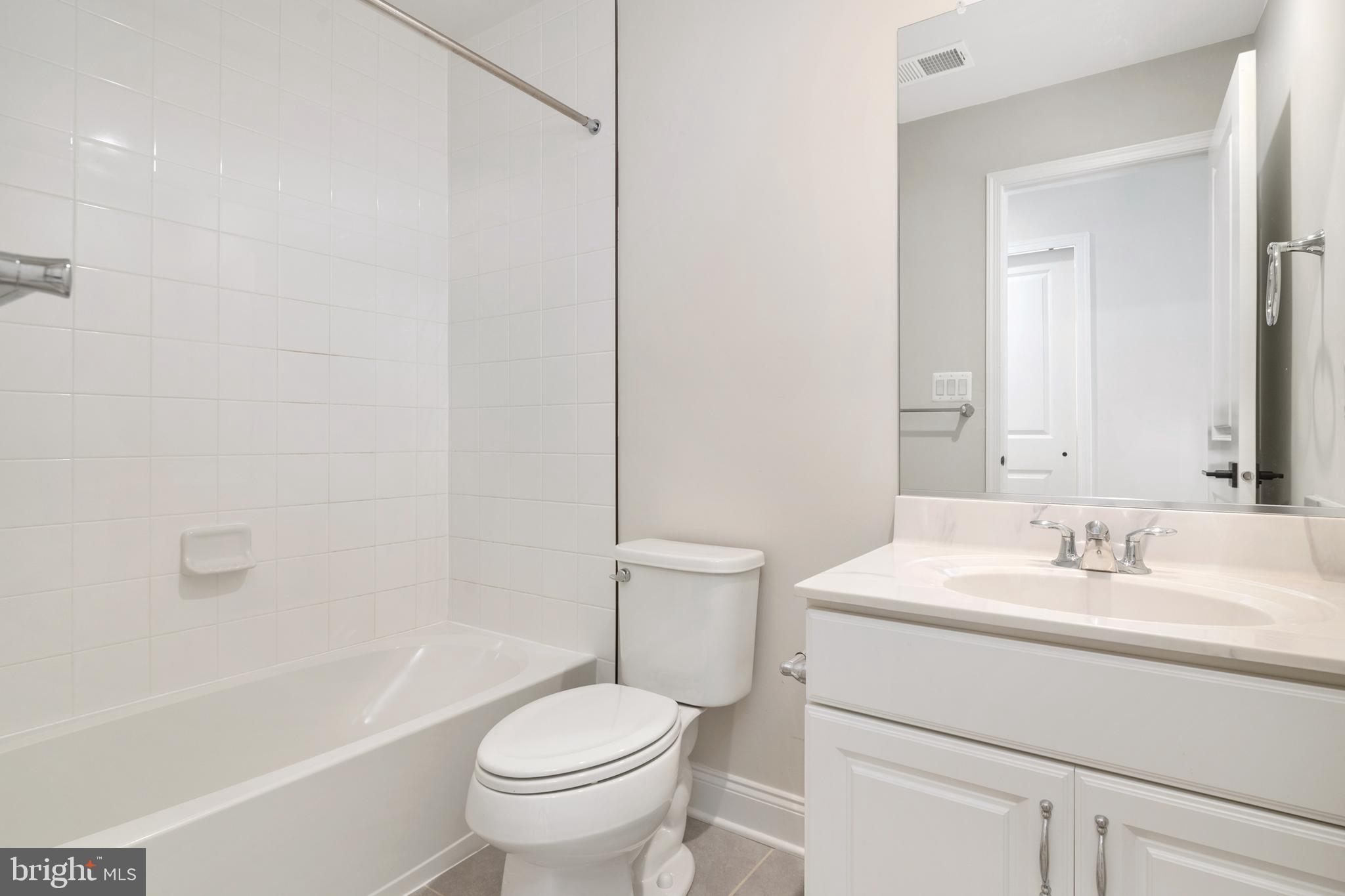 8631 St Anthony Drive Severn, MD 21144 - Photo 33 of 41 a bathroom with a sink toilet and shower