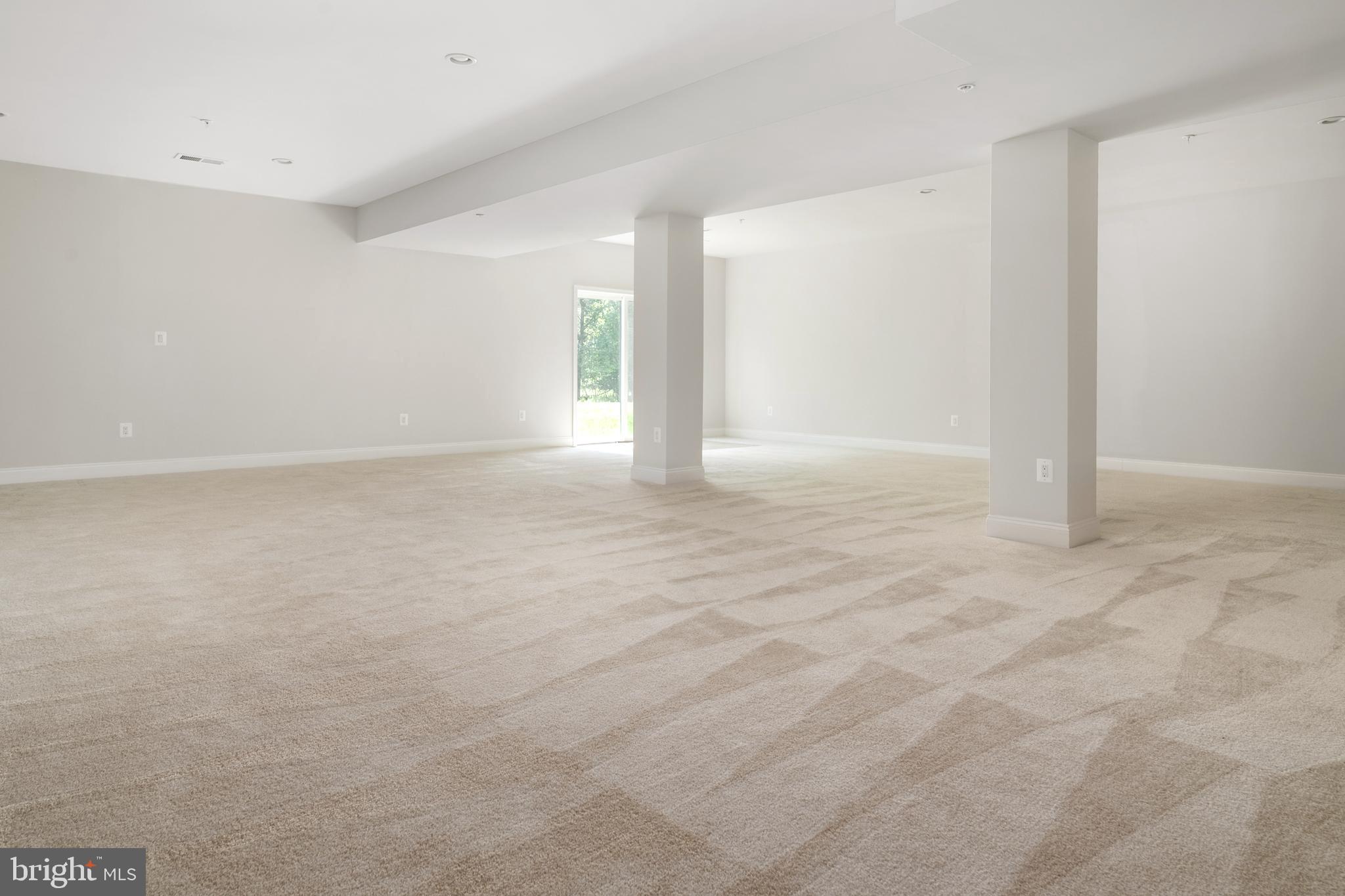 8631 St Anthony Drive Severn, MD 21144 - Photo 37 of 41 a view of an empty room with window and wooden floor
