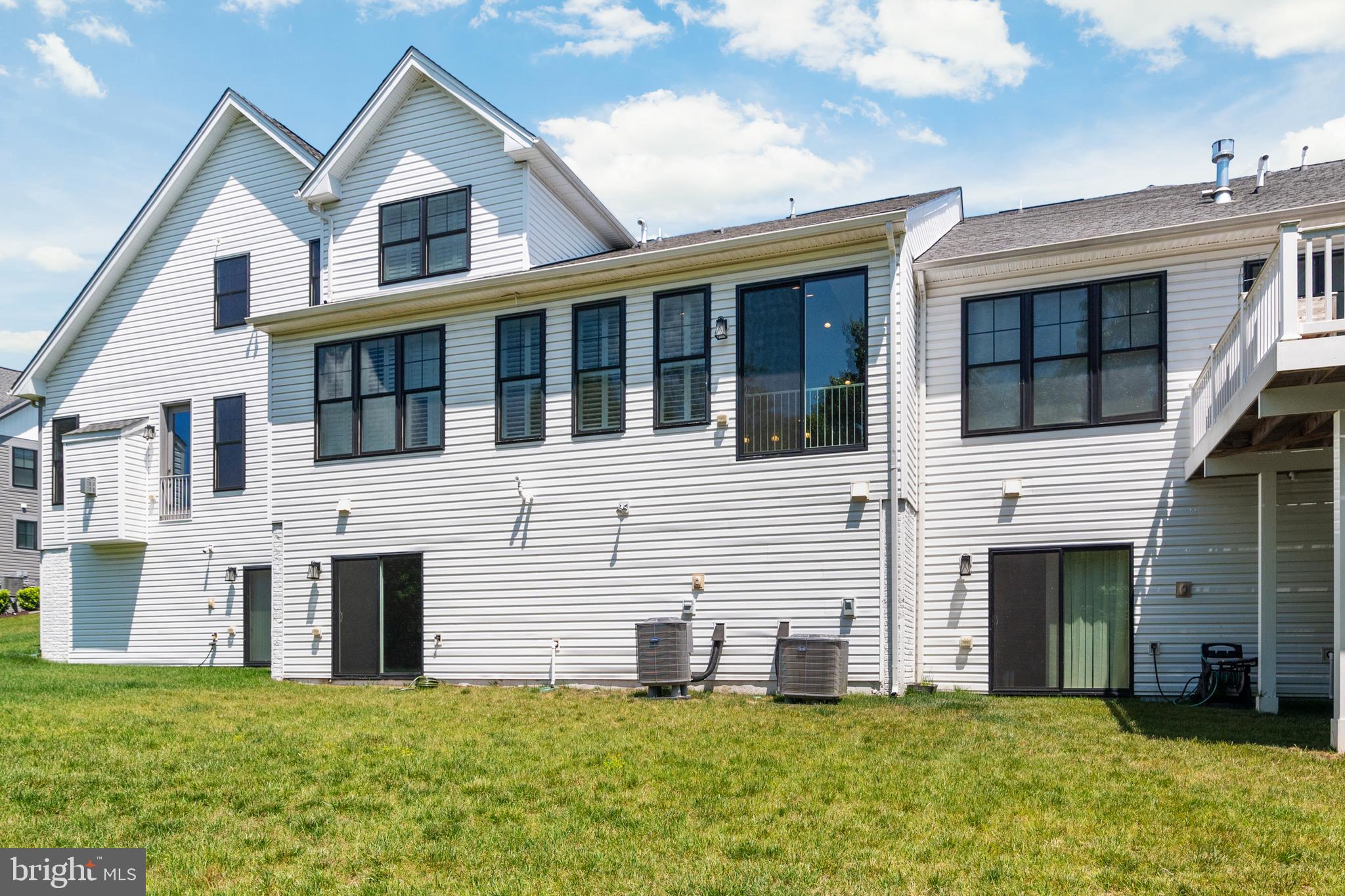 8631 St Anthony Drive Severn, MD 21144 - Photo 39 of 41 a front view of a house with a yard