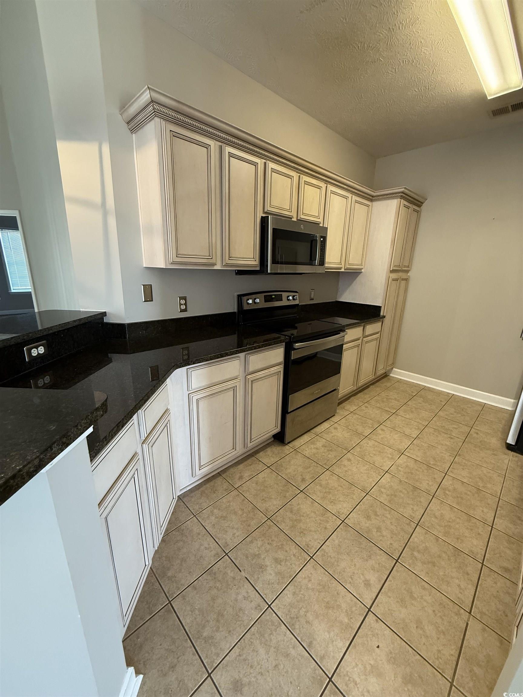 213 Wando River Road Myrtle Beach, SC 29579 - Photo 11 of 16 Kitchen featuring appliances with stainless steel