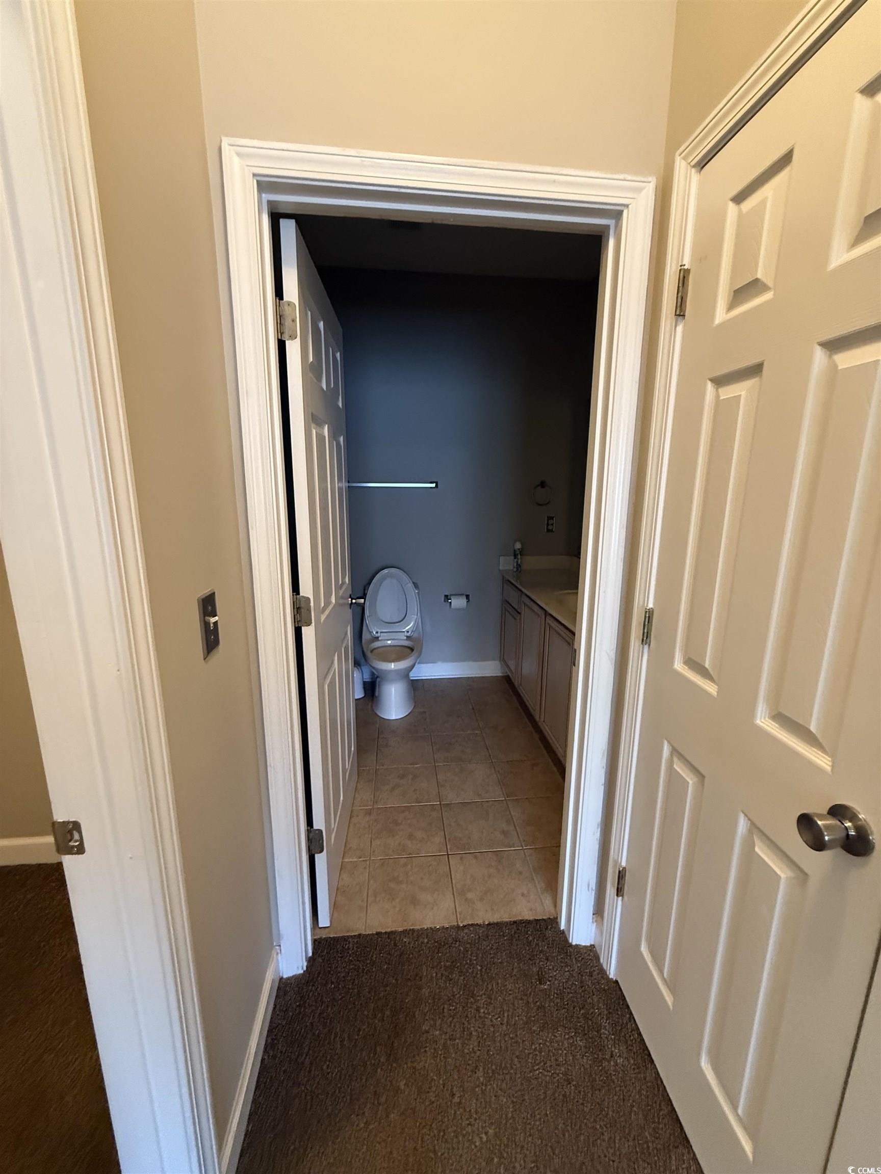 213 Wando River Road Myrtle Beach, SC 29579 - Photo 14 of 16 Hallway featuring light tile patterned floors and