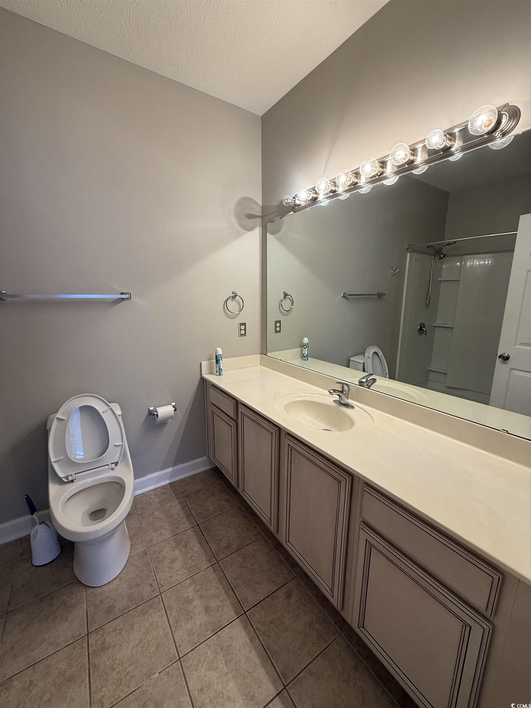 213 Wando River Road Myrtle Beach, SC 29579 - Photo 4 of 16 Bathroom with a shower, toilet, tile patterned flo