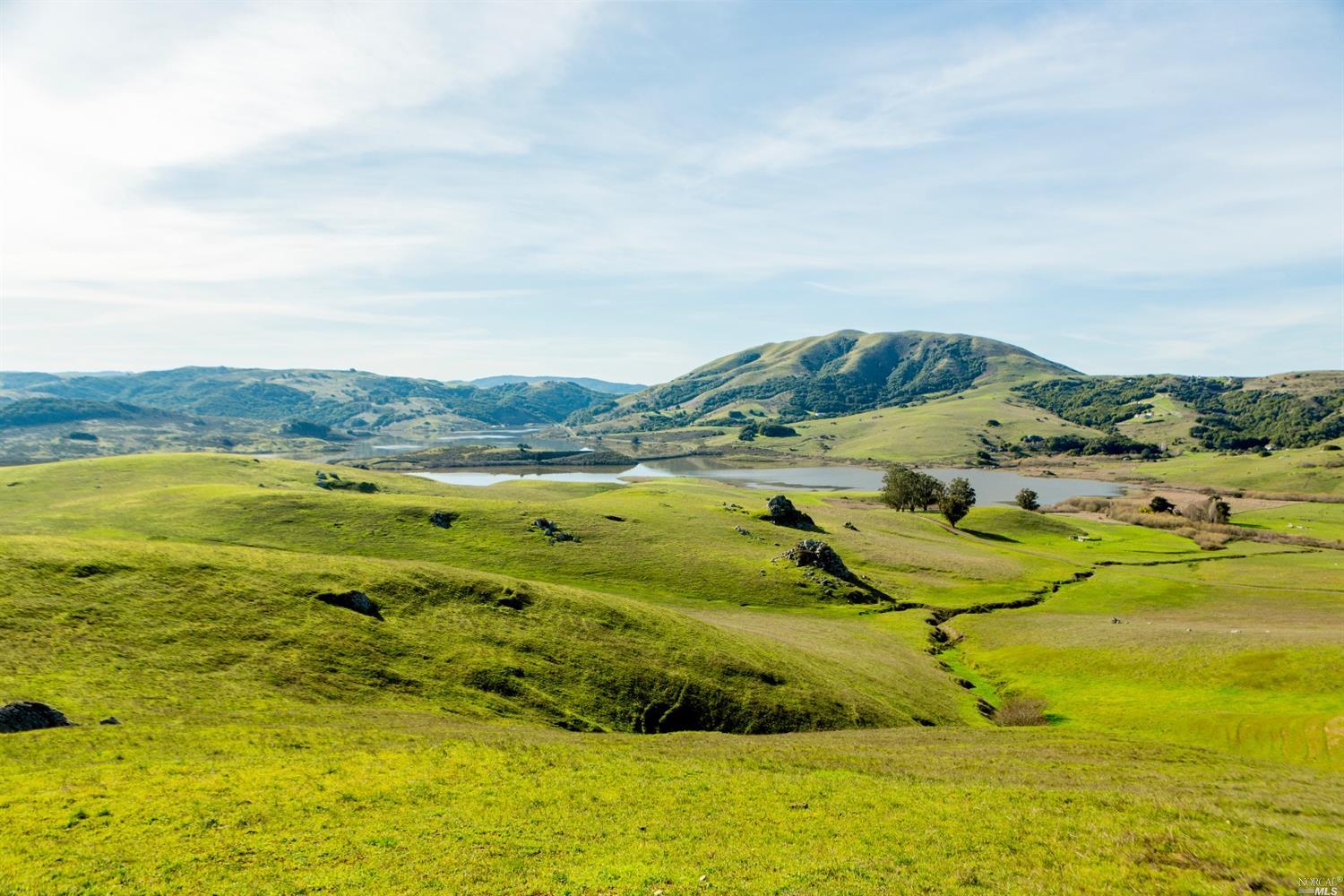 a view of an ocean from a mountain