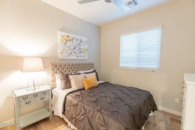 a bedroom with a bed and a table