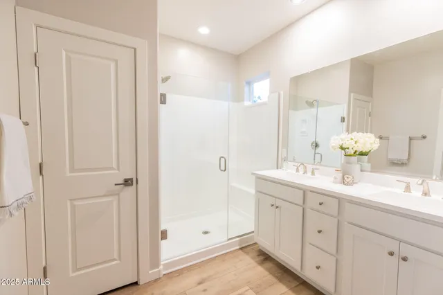 a bedroom with a bed a couch and a window