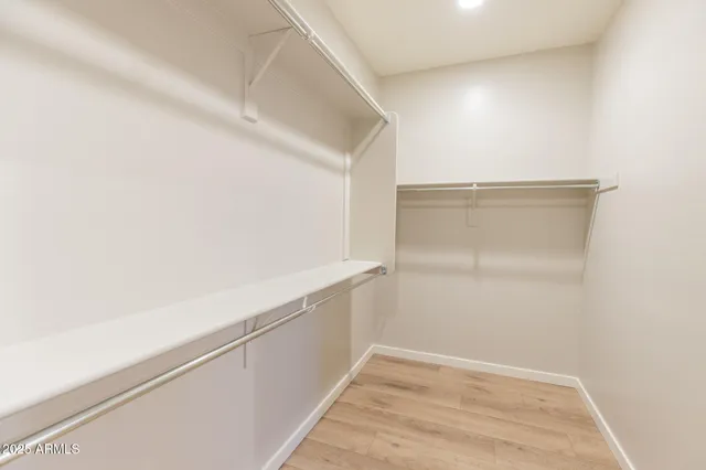 a bathroom with a double vanity sink and mirror