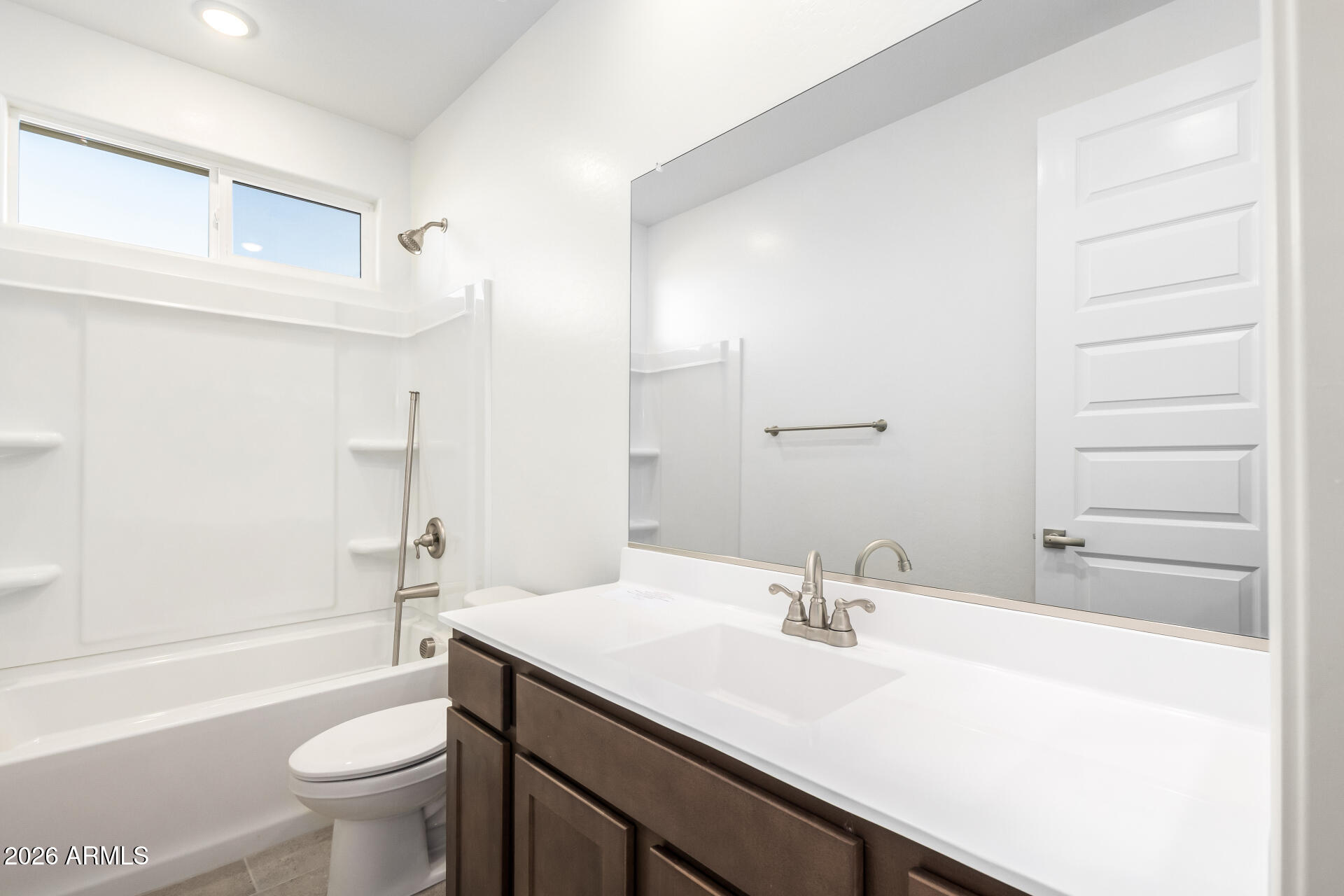 13232 West W Ranch Peoria, AZ 85383 - Photo 14 of 24 a bathroom with a sink a toilet and a bathtub