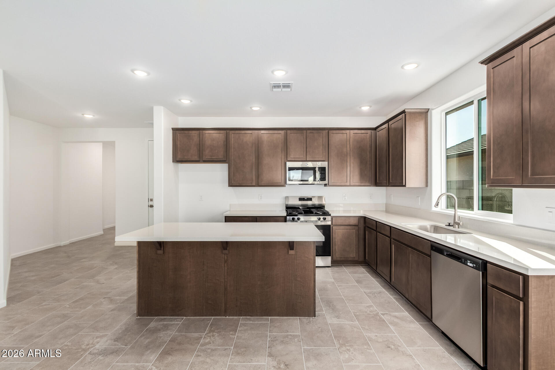 13232 West W Ranch Peoria, AZ 85383 - Photo 3 of 24 a large kitchen with stainless steel appliances lots of counter top space