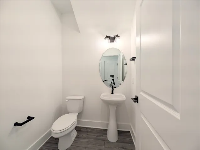 a view of a kitchen with a refrigerator and cabinets